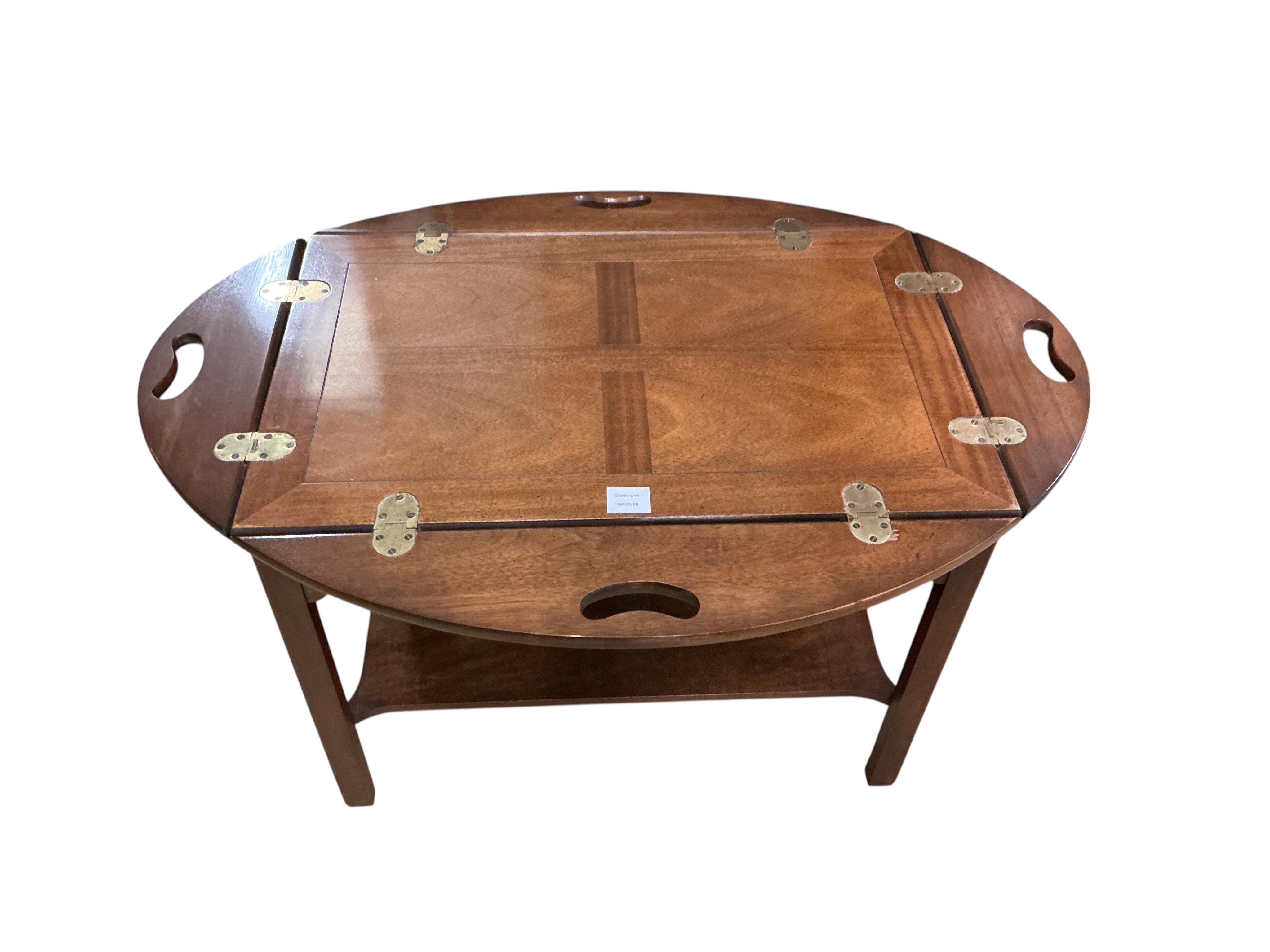 A reproduction George III style mahogany butler's tray, on stand, width 74cm, depth 48cm, height 68cm